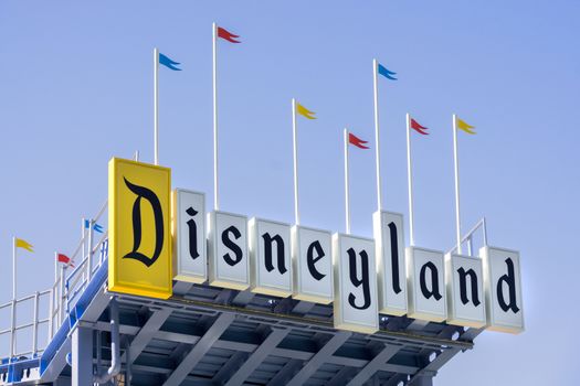 ANAHEIM, CA/USA - OCTOBER 10, 2015: Disneyland entrance sign. Disneyland Park, originally Disneyland, is the first of two theme parks built at the Disneyland Resort.