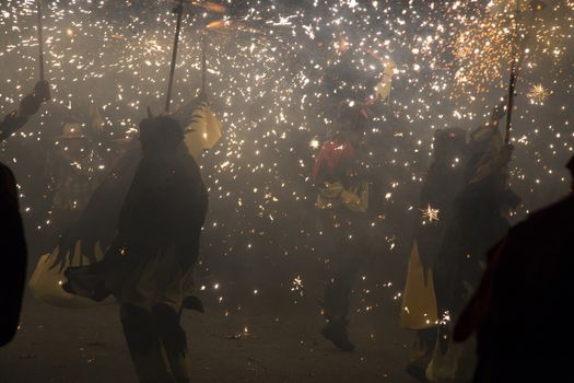 Barcelona, Spain- September 20, 2015: Fire Run or Correfoc, La Merce, Groups dress as devils and parade down the streets letting off fireworks.