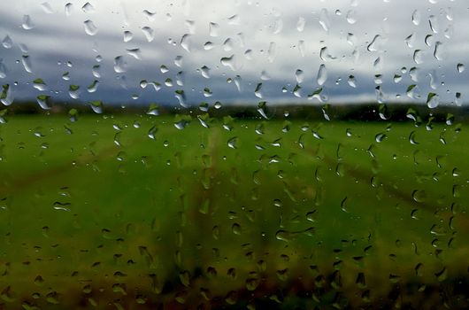 Raindrops on a windows train moving