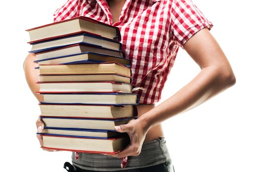 Unknown teenage girl holding stack of textbooks.