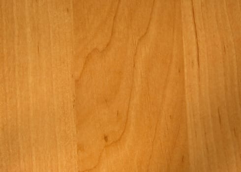 Smooth wooden board, board-colored light alder with visible vertical grain and texture.Horizontal view.