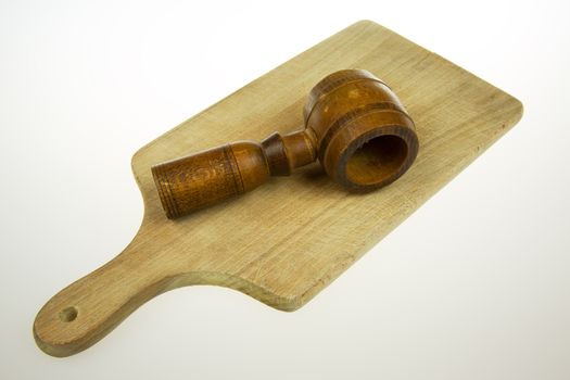 Old, historical nutcracker lying on the old worktop, isolated on a white background. Horizontal view.