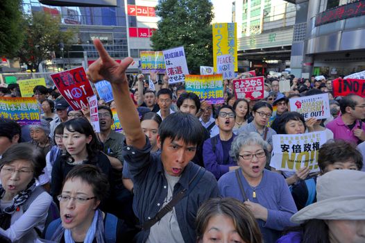 JAPAN, Tokyo : Thousands of people protest in Tokyo outside of Japan's parliament against new legislation that would allow the military to deploy overseas on October 19, 2015. The changes would allow Japanese troops to fight abroad for the first time since World War Two.