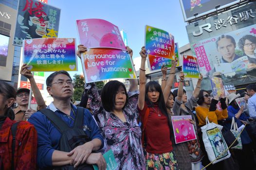 JAPAN, Tokyo : Thousands of people protest in Tokyo outside of Japan's parliament against new legislation that would allow the military to deploy overseas on October 19, 2015. The changes would allow Japanese troops to fight abroad for the first time since World War Two.