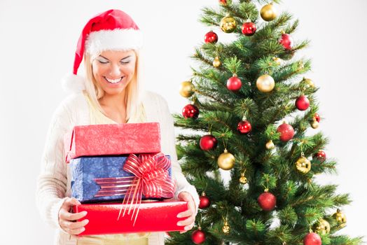 Beautiful happy christmas girl with christmas presents.