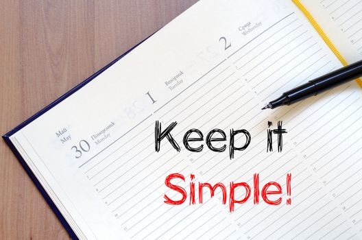 Keep it simple text concept write on notebook