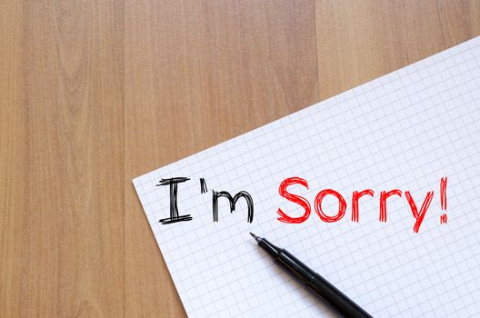 I'm sorry text concept write on notebook