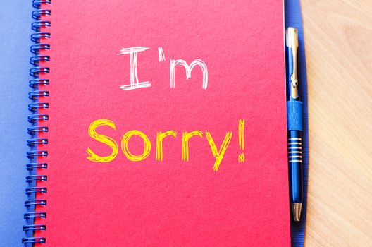 I'm sorry text concept write on notebook