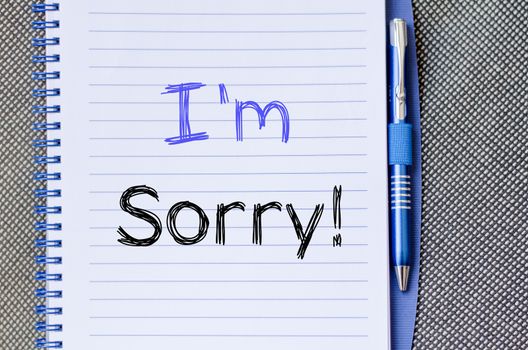 I'm sorry text concept write on notebook