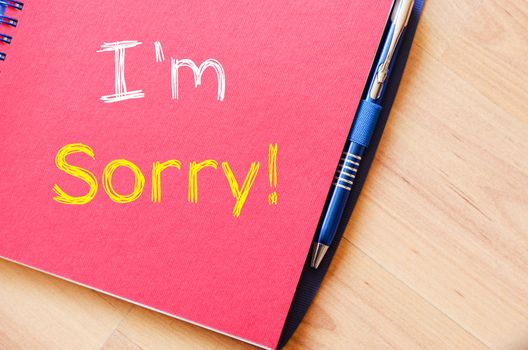 I'm sorry text concept write on notebook