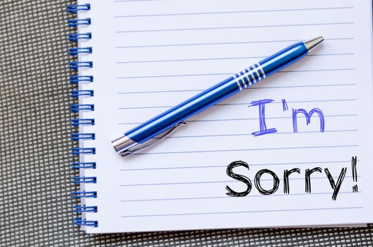 I'm sorry text concept write on notebook