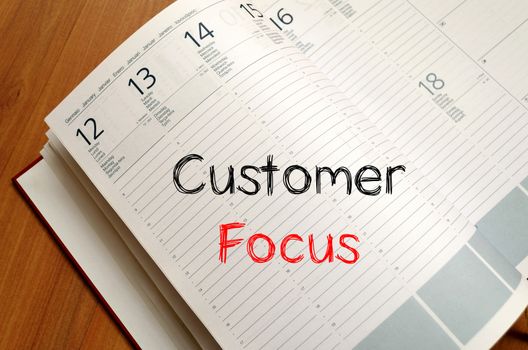 Customer focus text concept write on notebook