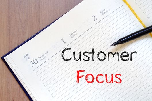 Customer focus text concept write on notebook