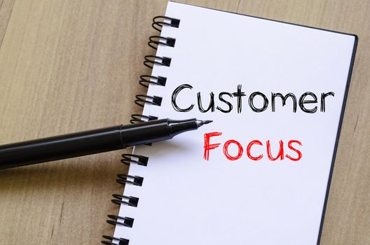 Customer focus text concept write on notebook