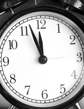 Photo alarm clock,  arrow close to12 hours