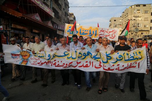 GAZA, Gaza City: Members of the Popular Front for the Liberation of Palestine participate in a protest in Gaza on October 20, 2015. The group is rallying against what it perceives to be Israeli aggression in Jerusalem, the occupied West Bank and Gaza region over the past month, during which an upsurge of violence, including stabbing and gun attacks, has led to the deaths of at least 37 Palestinians and seven Israelis.  