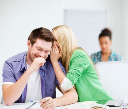 education concept - group of students gossiping at school