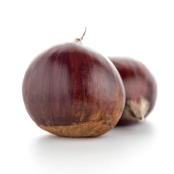 Chestnuts with shell isolated on white background.