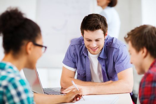 education concept - group of students studying at school