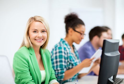 education concept - student girl with computer studying at school