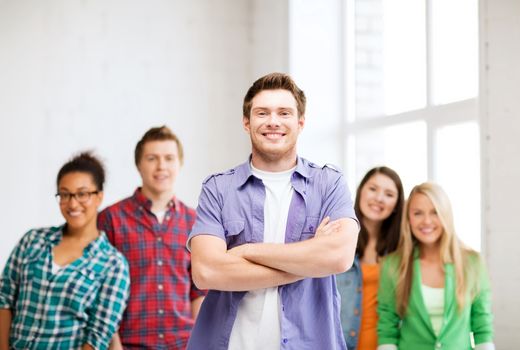 education concept - student boy with group of students at school