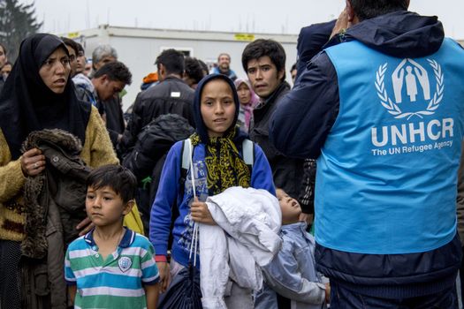 SERBIA, Berkasovo: Families of refugees are pictured in Berkasovo, Serbia, at the border with Croatia, waiting for passing to Bapska, Croatia, on October 17, 2015. In the following days, Austrian, Slovenian and Croatian authorities decided to limit the refugees' passage, causing a 	bottleneck in Berkasovo.