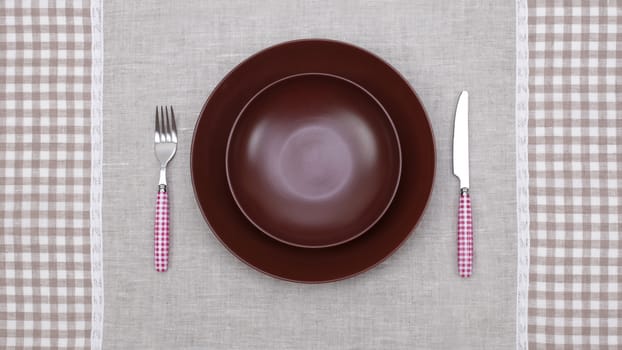 empty plate with fork and knife