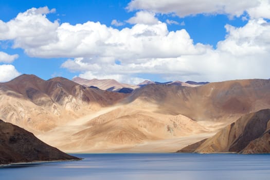 Pangong Tso Highland Lake in the Himalayas with the fantastic play of light and shadow in the surrounding mountains (Ladakh, northern India)