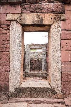 stone door ancient in castle, pimai castle, historical park and ancient castle in nakhon ratchasima thailand, sandstone (focus inside door)