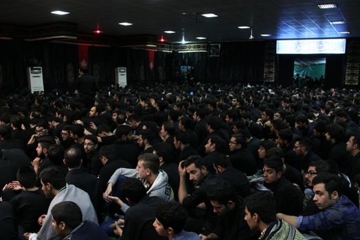 IRAN, Tehran : Hundreds of Shia Muslims gather in Reyhane-Al-Hossein complex building for mourning session in tribute to imam Husayn ibn Ali on October 21, 2015, the 8th night of Muharram. one of the holy months in the Islamic calendar in Tehran, Iran. 