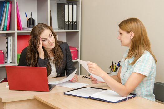 Young beautiful girl on reception at the office specialist
