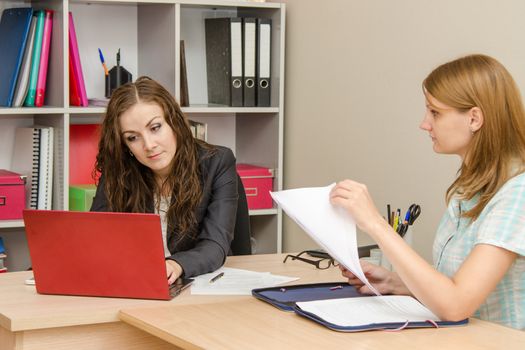 Young beautiful girl on reception at the office specialist