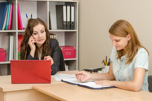 Young beautiful girl on reception at the office specialist