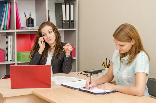 Young beautiful girl on reception at the office specialist