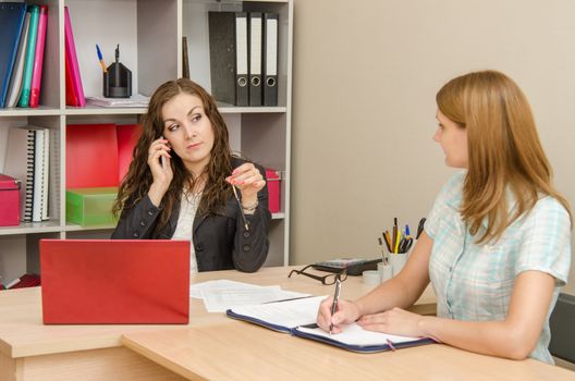 Young beautiful girl on reception at the office specialist