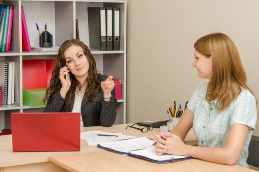 Young beautiful girl on reception at the office specialist