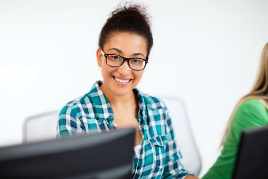 education, technology and internet - african student with computer studying at school