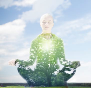 sport, fitness, yoga, double exposure and people concept - happy young woman meditating in lotus pose over blue sky and green tree background