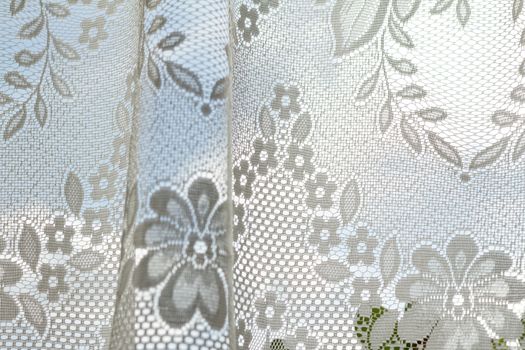 Photo of a lace curtains in the window