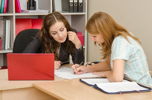 Young beautiful girl on reception at the office specialist