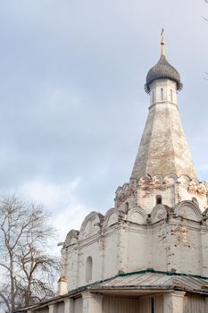 White tower with orthodox cross on the top
