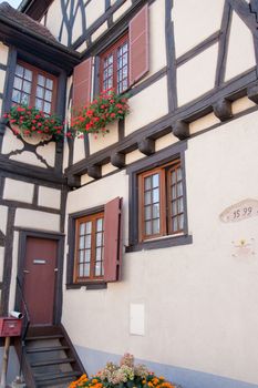 Walking in Alsace town old streets in summer europe vacation