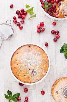 Different  cranberry cakes with fresh cranberries, top view