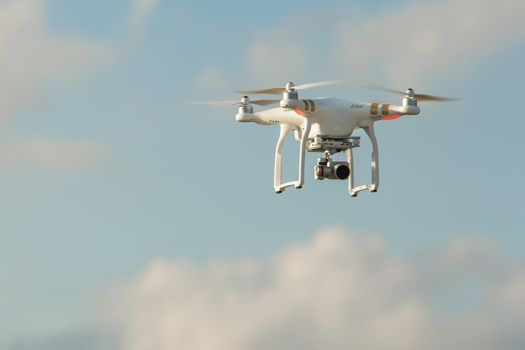 Remote control drone in flight over sky