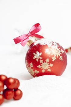 Christmas ball with red bow and ribbon