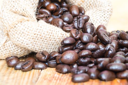 Coffee beans in sack closeup.