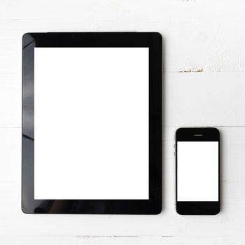 tablet and cellphone over white table