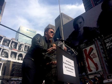 USA, New York: Hollywood director Quentin Tarantino speaks to the crowd during the #RiseUpOctober rally in Times Square, New York City on October 22, 2015. He joins activists and relatives of those who have died as a result of police violence in the United States as they told stories of those they had lost. The three-day #RiseUpOctober protest culminates on October 24 with a mass rally at Washington Square Park at 11am, and a march to Columbus Circle at 1pm, which thousands are expected to attend.