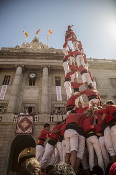 Barcelona, Spain - September 20, 2015: Castelers at La Merce. Human Castle building is a Catalonian tradition and is a UNESCO Masterpiece of the Oral and Intangible Heritage of Humanity