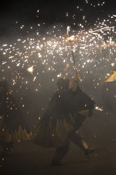 Barcelona, Spain- September 20, 2015: Fire Run or Correfoc, La Merce, Groups dress as devils and parade down the streets letting off fireworks.